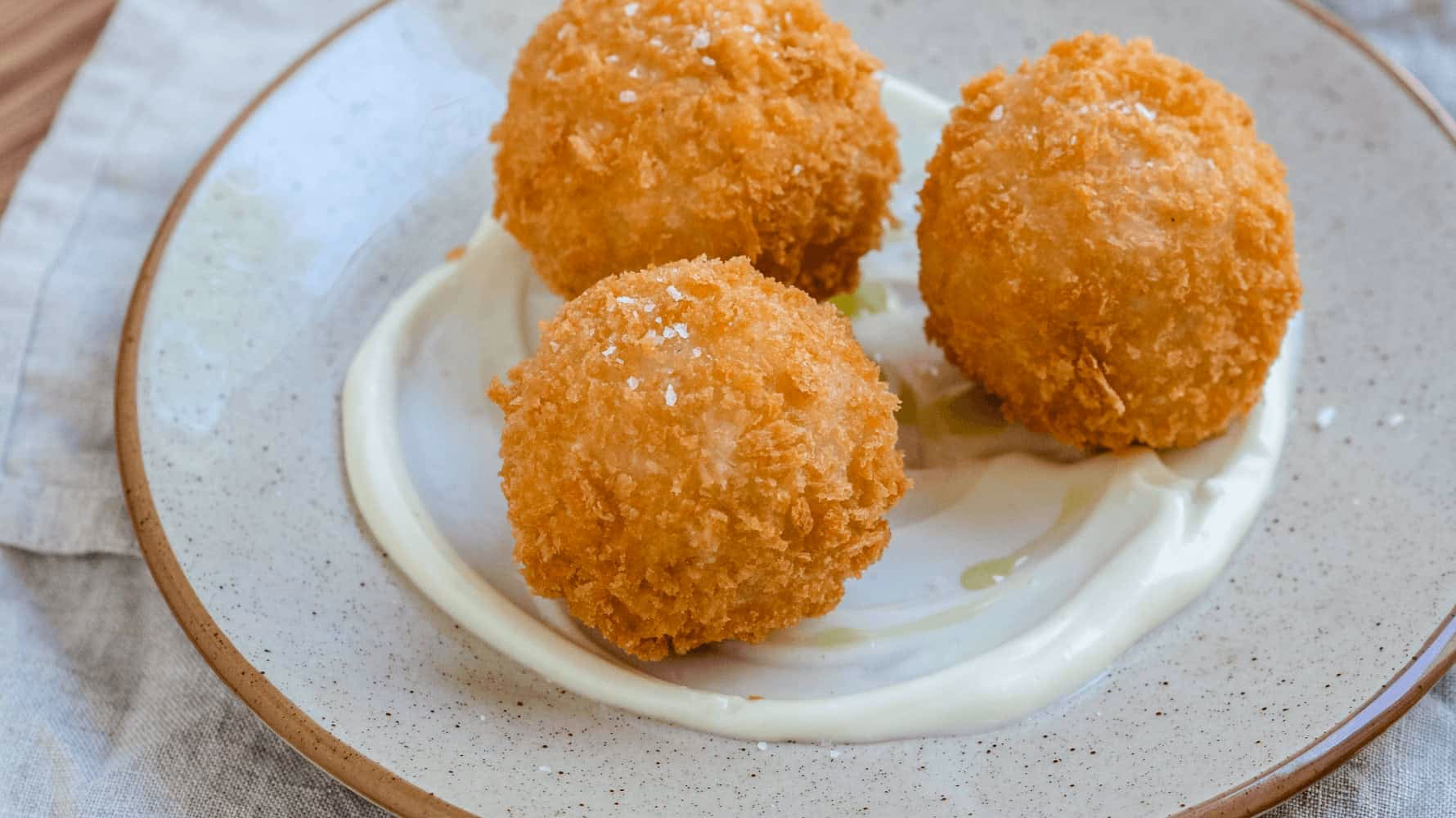 Hvad betyder arancini?